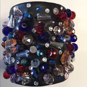 Leather , Chinese, German and Swarovski Crystals.